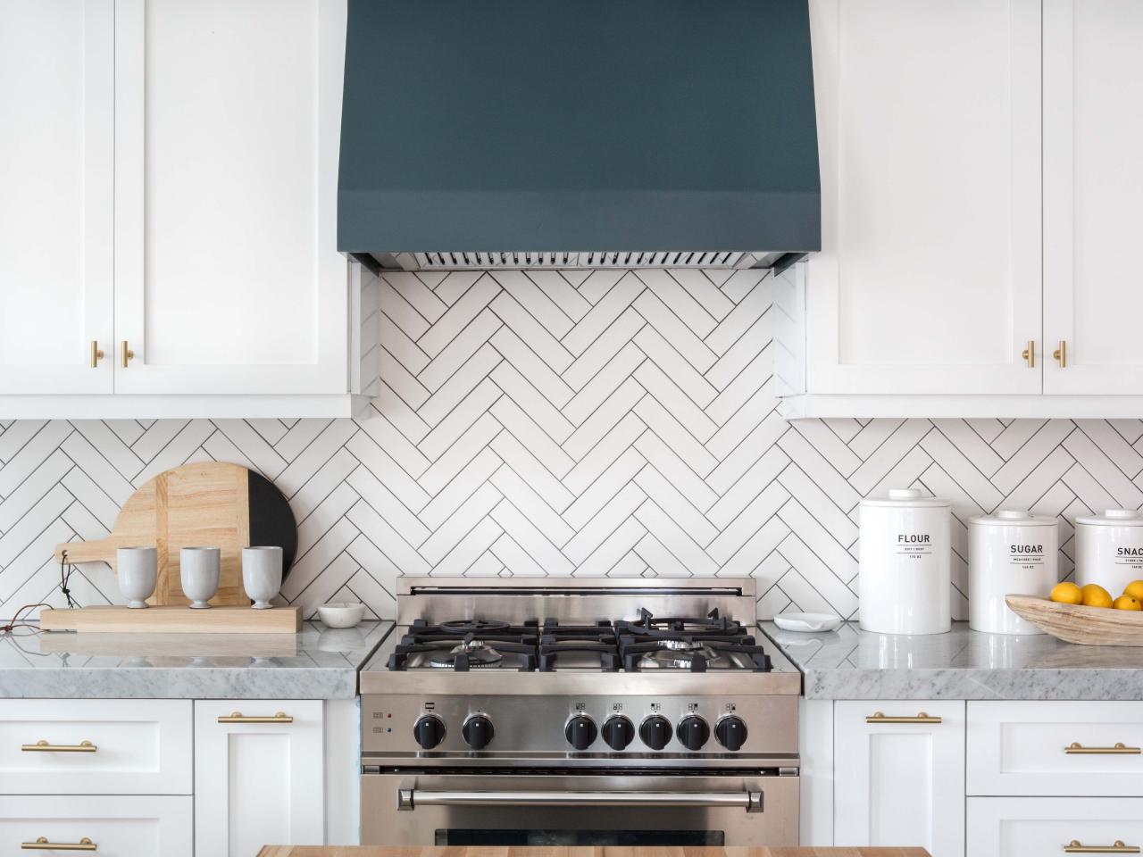 Blue Gray Range Hood Adds Color To White Kitchen